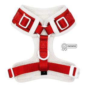 Red and white dog harness with patented label on a white background