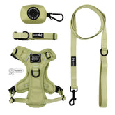 The Sassy Woof Dog Four Piece Bundle - Matcha includes a light green padded, adjustable harness, collar, leash with black hardware, and waste bag holder—stylish pet accessories from the Matcha collection.