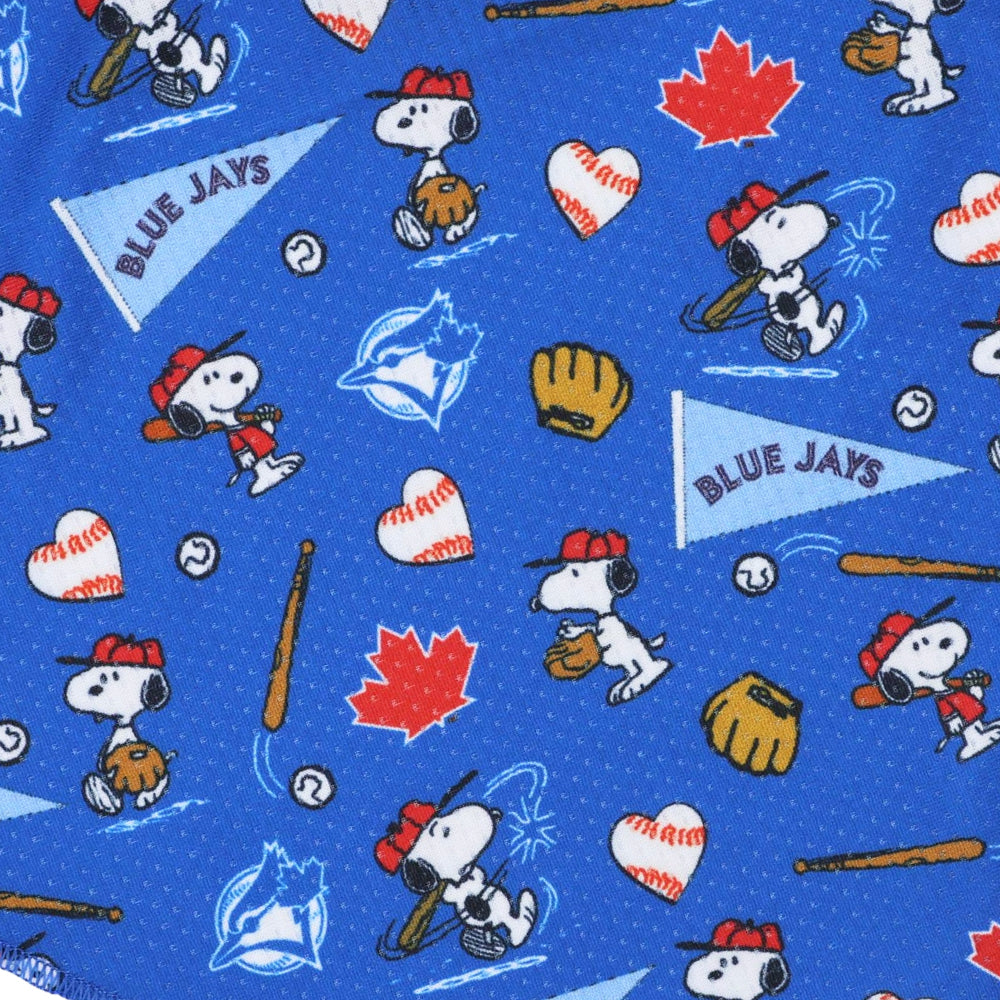The Sassy Woof Dog Bandana - MLB™ x Peanuts™ Toronto Blue Jays™ features cartoon Snoopy playing baseball, team logos, pennants, red maple leaves, bats, gloves, baseballs, and heart-shaped baseballs on a blue dotted background.