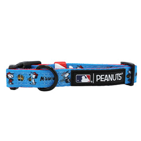 The Sassy Woof Dog Collar - MLB™ x Peanuts™ Miami Marlins™ is a blue adjustable collar featuring Peanuts characters, Miami Marlins branding, a black plastic buckle, metal D-ring, and a Peanuts tag beside the MLB logo.