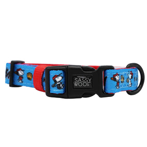 The Harness Three Piece Bundle - MLB™ x Peanuts™ Miami Marlins™ by Sassy Woof features a blue and red dog collar with cartoon dog illustrations, a black plastic Sassy Woof buckle, D-ring for leash attachment, and pairs perfectly with an adjustable harness.