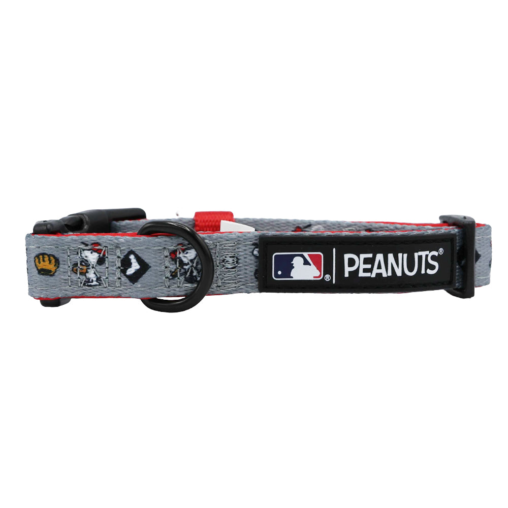 The Sassy Woof Dog Collar - MLB™ x Peanuts™ Chicago White Sox™ is a gray adjustable collar with Snoopy and baseball icons, featuring team logos, a black buckle, and metal ring for leash attachment.