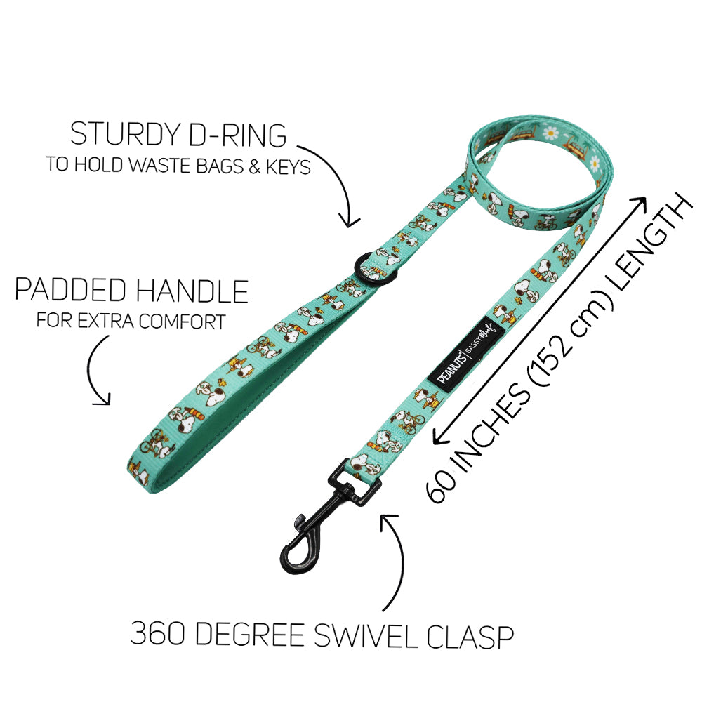 The Sassy Woof Dog Leash - Peanuts™ Road Trippin' features cartoon dog prints, a sturdy D-ring, padded handle, and 360° swivel clasp. At 60 inches (152 cm) long, it's a comfortable and fun choice for any dog's adventure gear.