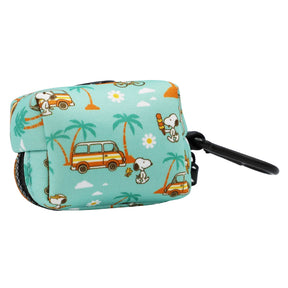 The Sassy Woof Dog Waste Bag Holder - Peanuts™ Road Trippin' in teal neoprene features Snoopy, palm trees, yellow cars, and flowers with a black clip—ideal for pairing with harnesses or adventure dog gear.