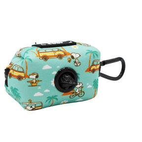 The Sassy Woof Dog Waste Bag Holder - Peanuts™ Road Trippin' is a teal, rectangular neoprene holder with Snoopy, yellow vans, and palm trees, plus a black clip and roll of bags—great for dog adventures or matching your harness.