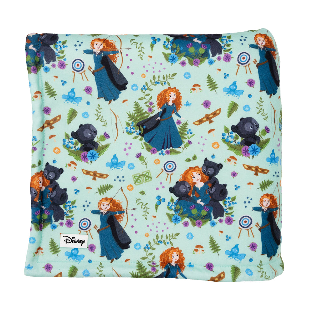 The Sassy Woof Pet Blanket - Disney's Merida features light green fabric with Princess Merida, her bear brothers, archery targets, and forest elements—a perfect Brave-inspired dog accessory.