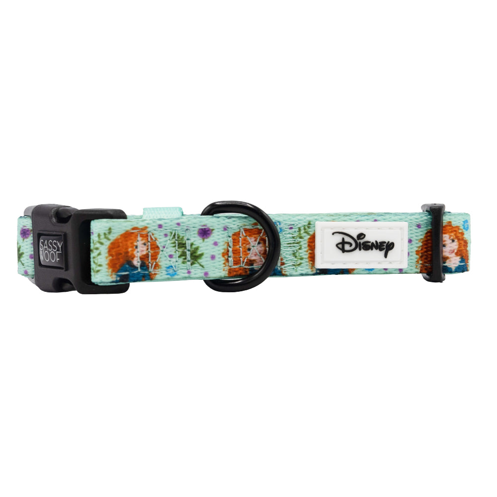 The Sassy Woof Dog Collar - Disney's Merida features a light blue floral design with Merida illustrations, an adjustable fit, black buckle and ring, plus a white Disney logo tag.