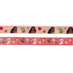 The Sassy Woof Dog Two Piece Bundle - Disney's Moana features a top ribbon with Moana among green leaves and pink flowers, and a bottom ribbon with white kittens, seashells, birds, and yellow flowers on a pink background.
