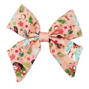 The Sassy Woof Dog Sailor Bow - Disney's Moana features a peach color with cartoon Moana, tropical leaves, flowers, and island designs—ideal for Moana fans or anyone seeking an ocean-inspired accessory for their dog.