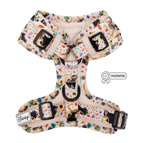 The Sassy Woof Dog Adjustable Harness - Disney's Pocahontas features a playful character print, black buckles, Disney label, small Patented badge, and is part of the Puppy Growth Pawtection Plan for growing pups.