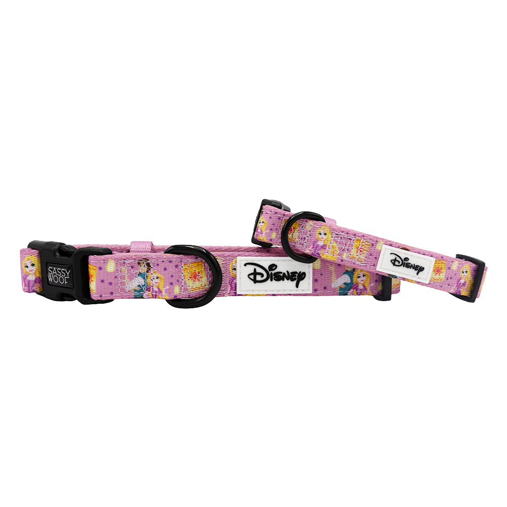Two pink "Dog Collar - Disney's Rapunzel" by Sassy Woof from the Disney dog collection, featuring princess designs, black buckles, and a white Disney logo patch. Each adjustable collar is displayed on a white background.