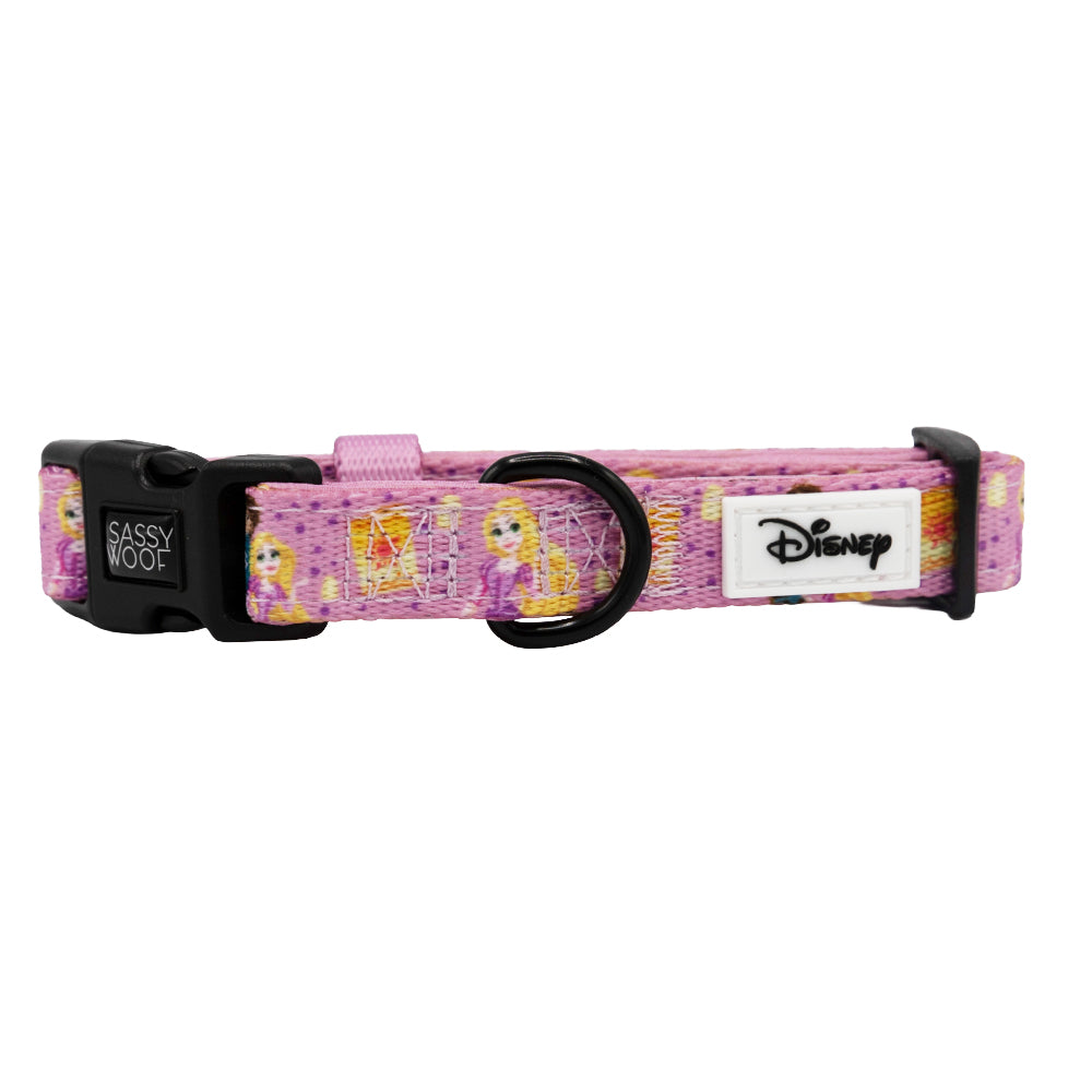The Sassy Woof Dog Collar – Disney’s Rapunzel features pink Rapunzel graphics, a black buckle, white Disney logo patch, adjustable fit, and a metal D-ring for leash attachment. Part of the Disney dog collection.