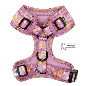 The Sassy Woof Dog Adjustable Harness - Disney's Rapunzel features pink fabric with Tangled Rapunzel designs, purple buckles, an adjustable fit, and a patented badge graphic on the side.