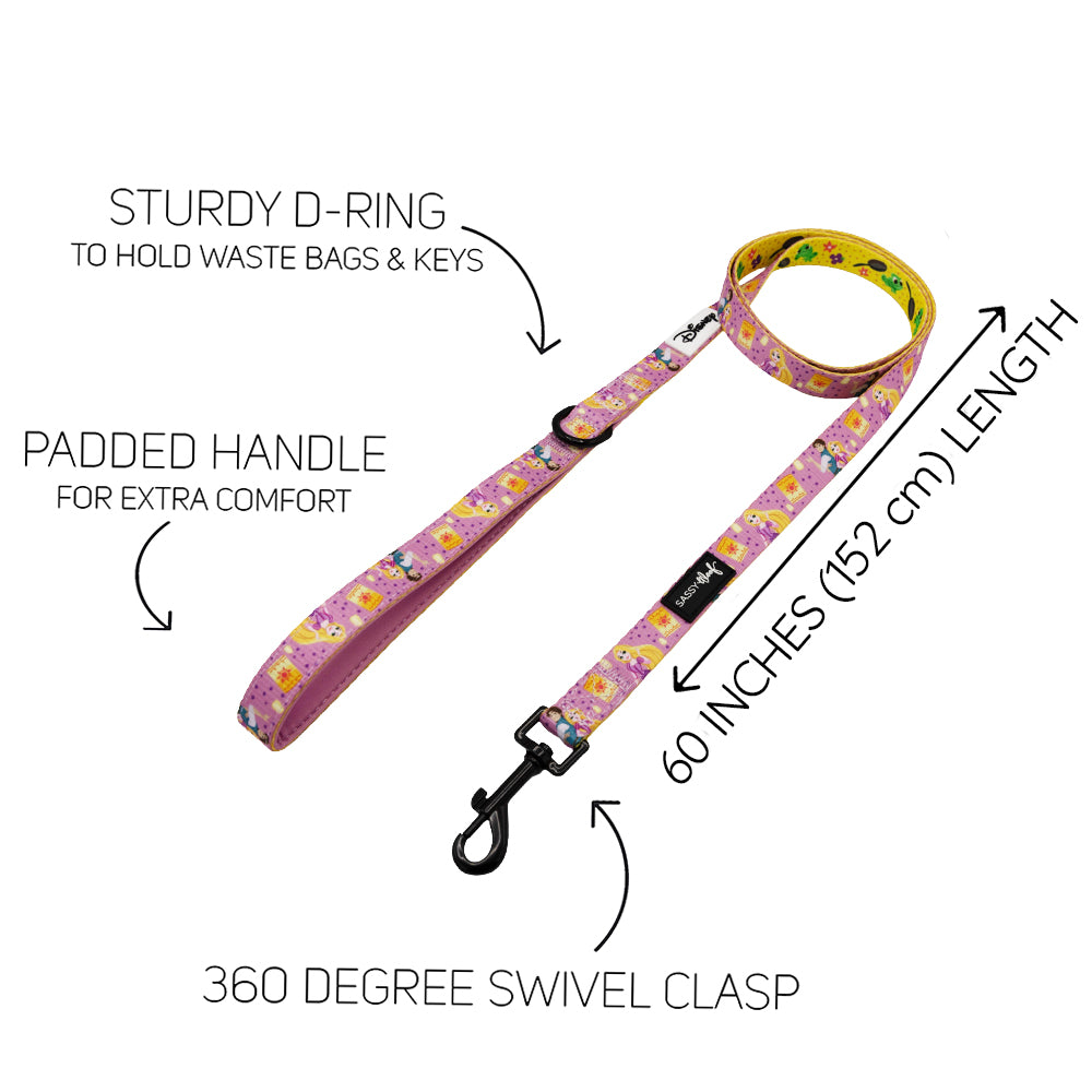 The Harness Three Piece Bundle - Disney’s Rapunzel by Sassy Woof features a 60-inch pink leash with cartoon prints, sturdy D-ring, padded handle for comfort, and 360° swivel clasp. Text highlights key features around the leash.