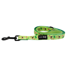 The Sassy Woof Dog Leash - Disney's Tiana features a green design with cartoon dogs and bones, a black metal clasp, and a black Sassy Woof label—perfect to pair with your Princess and the Frog harness for a magical touch.