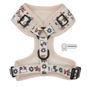 The Sassy Woof Dog Adjustable Harness – Weenie Wonderland features a beige mesh design with vibrant cartoon animal illustrations, adjustable black buckles, and a PATENTED badge icon on the right side—an ideal choice for dachshunds or as a playful addition to your pup’s winter accessories.