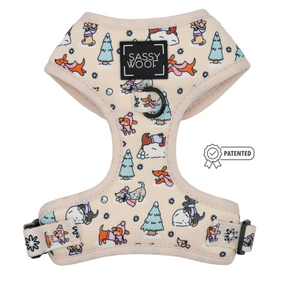 Introducing the Dog Two Piece Bundle - Weenie Wonderland by Sassy Woof: a cream-colored winter harness showcasing playful cartoon dachshunds, snowmen, trees, and snowflakes. The Sassy Woof logo patch is centered at the top, and a Patented badge appears to the right—making this bundle both stylish and fun for your pup.