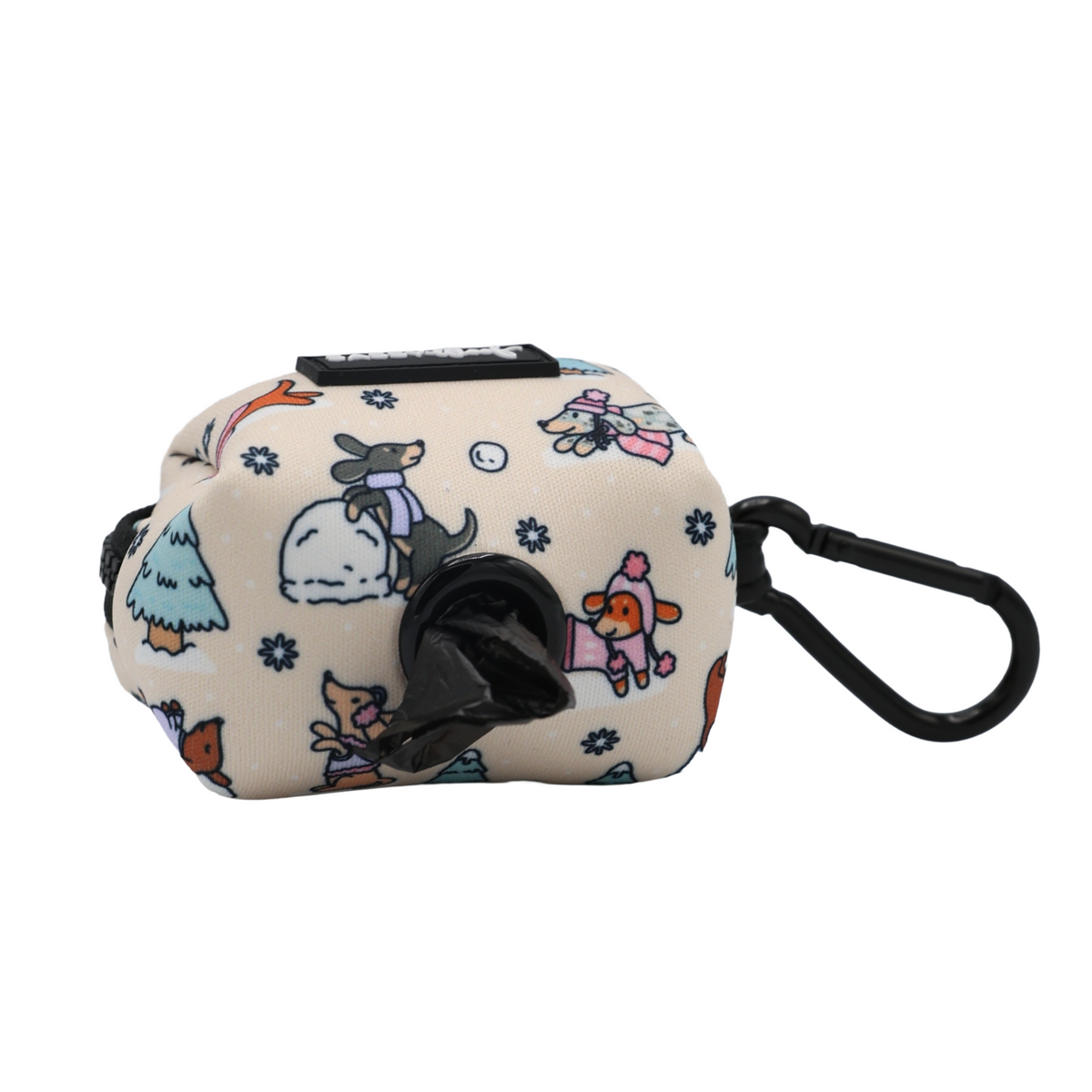 Add playful style to your walks with the Sassy Woof Dog Waste Bag Holder - Weenie Wonderland. This beige pouch features a black clip and a front dispenser hole, adorned with cartoon dogs—including adorable dachshunds in cozy winter accessories—plus snowflakes and trees. Part of the Weenie Wonderland Collection, it’s a charming way to carry waste bags on your outings.