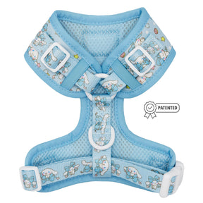 The Sassy Woof Dog Adjustable Harness - Cinnamoroll™ is a light blue no-pull harness featuring mesh fabric, white buckles, and a cute pattern with bunnies and stars, plus a patented badge on the side.