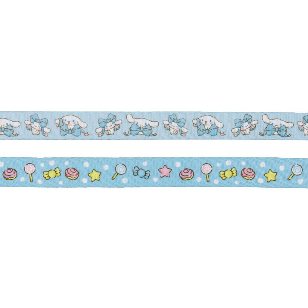 The Sassy Woof Dog Four Piece Bundle - Cinnamoroll™ includes two blue ribbons: one with a cute white character with blue ears and a bow, and another featuring pastel candies, stars, and polka dots for a playful look.