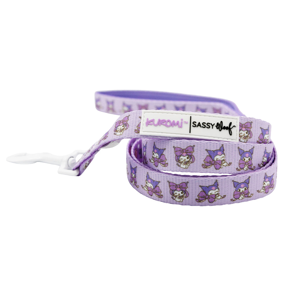 The Collar Three Piece Bundle - Kuromi™ by Sassy Woof features a purple leash with Kuromi and cartoon characters in purple outfits and bows, plus visible Kuromi and Sassy Woof labels—ideal for fans of Kuromi dog accessories.