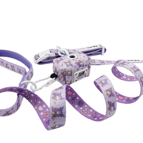 The Sassy Woof Collar Three Piece Bundle - Kuromi™ features a purple leash and matching waste bag holder with cartoon cats, hearts, bows, and cute designs—perfect for Hello Kitty dog accessory fans—shown on a white background.