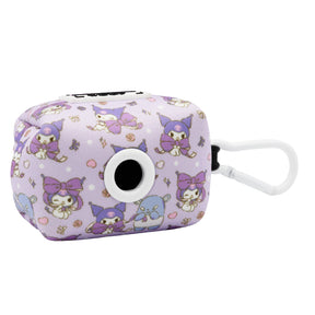 A small, rectangular Dog Four Piece Bundle - Kuromi™ case by Sassy Woof with a white clip and purple pattern featuring cartoon characters, including skulls and bows. It has a circular opening on one side—ideal for Hello Kitty fans.