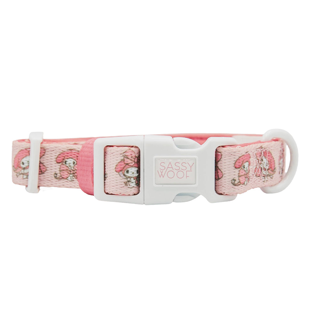 The Sassy Woof Dog Collar - My Melody™ features a pink, adjustable design with a white buckle and playful My Melody illustrations—an adorable addition to any Hello Kitty pet accessories collection.