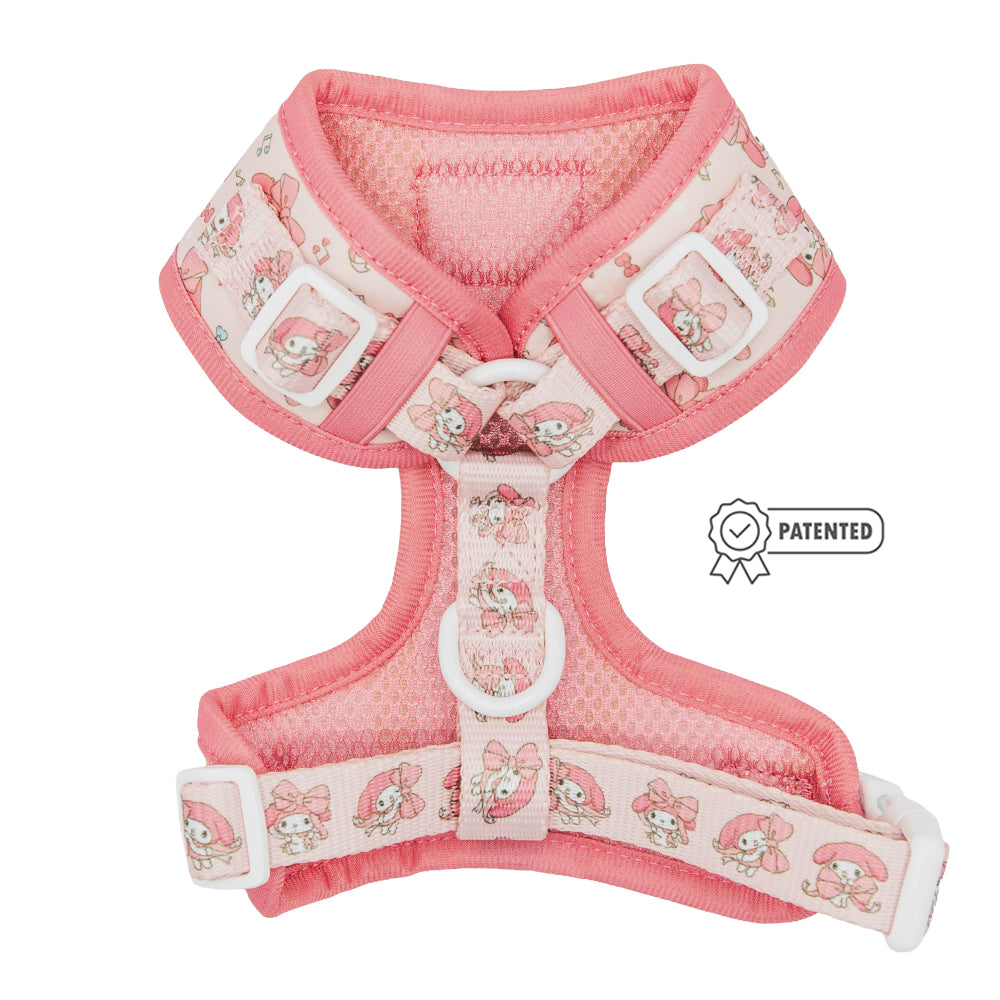 The Sassy Woof Dog Adjustable Harness - My Melody™ features a pink design with white buckles, custom character print on the straps and chest piece, plus a patented icon—ideal for your puppy’s growth plan.