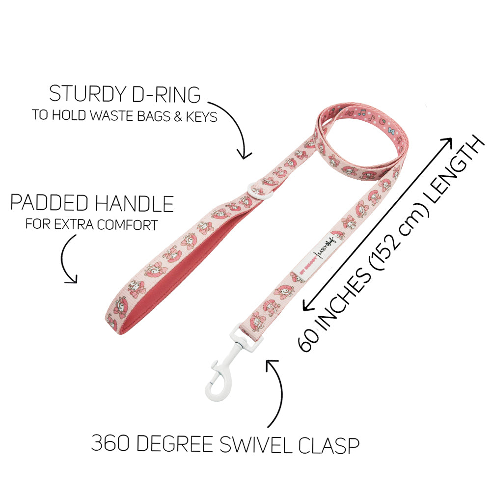 The Sassy Woof Dog Leash - My Melody™ features a pink floral design, padded handle, sturdy D-ring, and 360° swivel clasp. Measures 60 inches (152 cm). Highlighted for its cute style, comfort, and practicality.