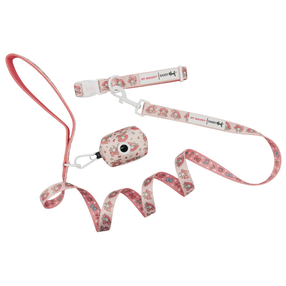 The Sassy Woof Collar Three Piece Bundle - My Melody™ includes a pink leash, adjustable collar, and matching waste bag holder with cute cartoon designs and sturdy clasps.