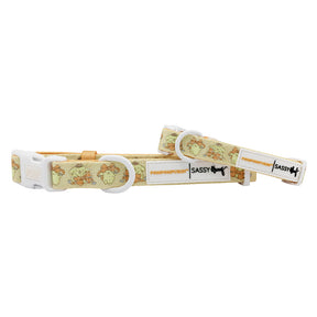 The Sassy Woof Dog Collar - Pompompurin™ is a yellow adjustable collar with white buckles, playful Pompompurin™ cartoon print, and designed for comfort and daily wear.