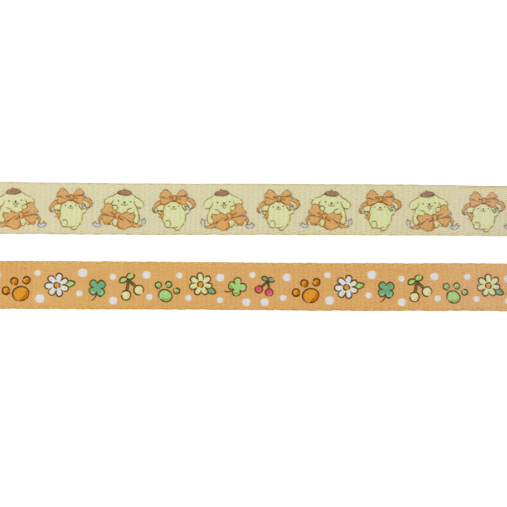 The Dog Two Piece Bundle - Pompompurin™ by Sassy Woof includes two decorative tapes: one with repeating cartoon dogs with orange bows, and another with flowers, paw prints, and dots on an orange background.