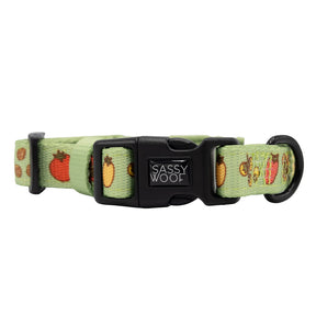 The Sassy Woof Dog Collar - Feeling Vine is a light green, adjustable collar with a black plastic buckle and D-ring, featuring playful fruit and burger designs and the Sassy Woof logo—ideal for pups on the Puppy Growth Pawtection Plan.
