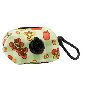 The Sassy Woof Dog Waste Bag Holder - Feeling Vine features a tomato pattern, black clip, and dispenser opening—a stylish neoprene pick from our plant-inspired collection, perfect for coordinating with your dog accessories.
