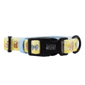 The Dog Four Piece Bundle - Patch Perfect by Sassy Woof features a yellow collar with light blue edges, bee and bow prints, a black SASSY WOOF buckle, and a sturdy black metal ring for leash attachment.