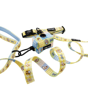The Sassy Woof Dog Three Piece Bundle - Patch Perfect includes a pastel leash and matching waste bag holder with animal, flower, and picnic patterns, plus plastic clasps—pairs perfectly with our Patch Perfect collar.