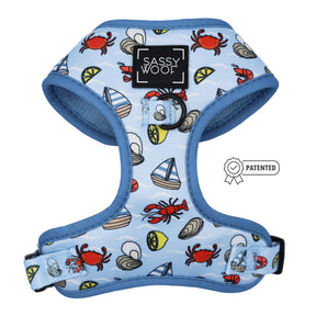 The Sassy Woof Dog Four Piece Bundle - Coastal Cuties features a blue adjustable harness with nautical prints—red crabs, sailboats, seashells—plus blue edging, back D-ring, and a “PATENTED” badge.