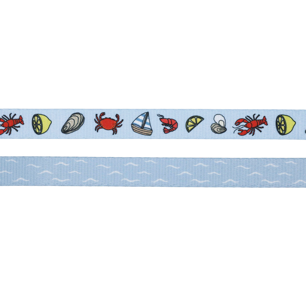 The Sassy Woof Dog Four Piece Bundle - Coastal Cuties features a light blue ribbon with crabs, shrimp, shells, lemon slices, and sailboats plus a matching white wave ribbon. Ideal for crafting an adjustable harness or pairing with puppy growth pawtection plan.