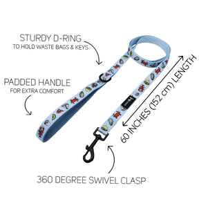 The Sassy Woof Dog Four Piece Bundle - Coastal Cuties includes a light blue leash with cartoon graphics, padded handle, sturdy D-ring, 360° swivel clasp (60"/152cm); pairs perfectly with its adjustable harness.