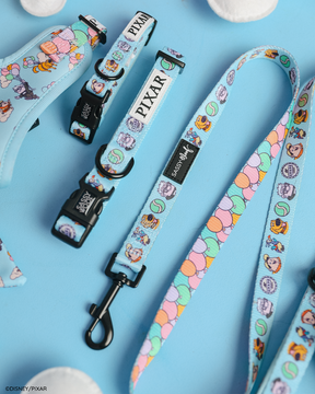 Sassy Woof’s Dog Collar - Disney and Pixar's Up is shown on a blue surface, featuring colorful character and balloon designs from Disney and Pixar.