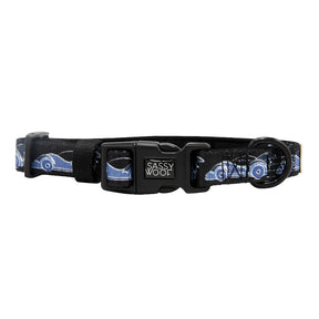 Black dog collar with a black buckle, sturdy metal ring, and a repeating Batman™ design. The collar features the Sassy Woof logo on the buckle and is part of the exclusive DC x Sassy Woof Dog Collar Three Piece Bundle - Batman™. Pair it with your favorite dog leash for ultimate superhero style.