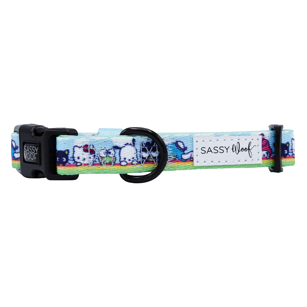 The Sassy Woof Dog Collar - Hello Kitty® & Friends In the Sky features a blue adjustable fit, plastic buckle, black D-ring, and white logo patch. Its playful design is ideal for fans seeking a fun Hello Kitty-themed collar.