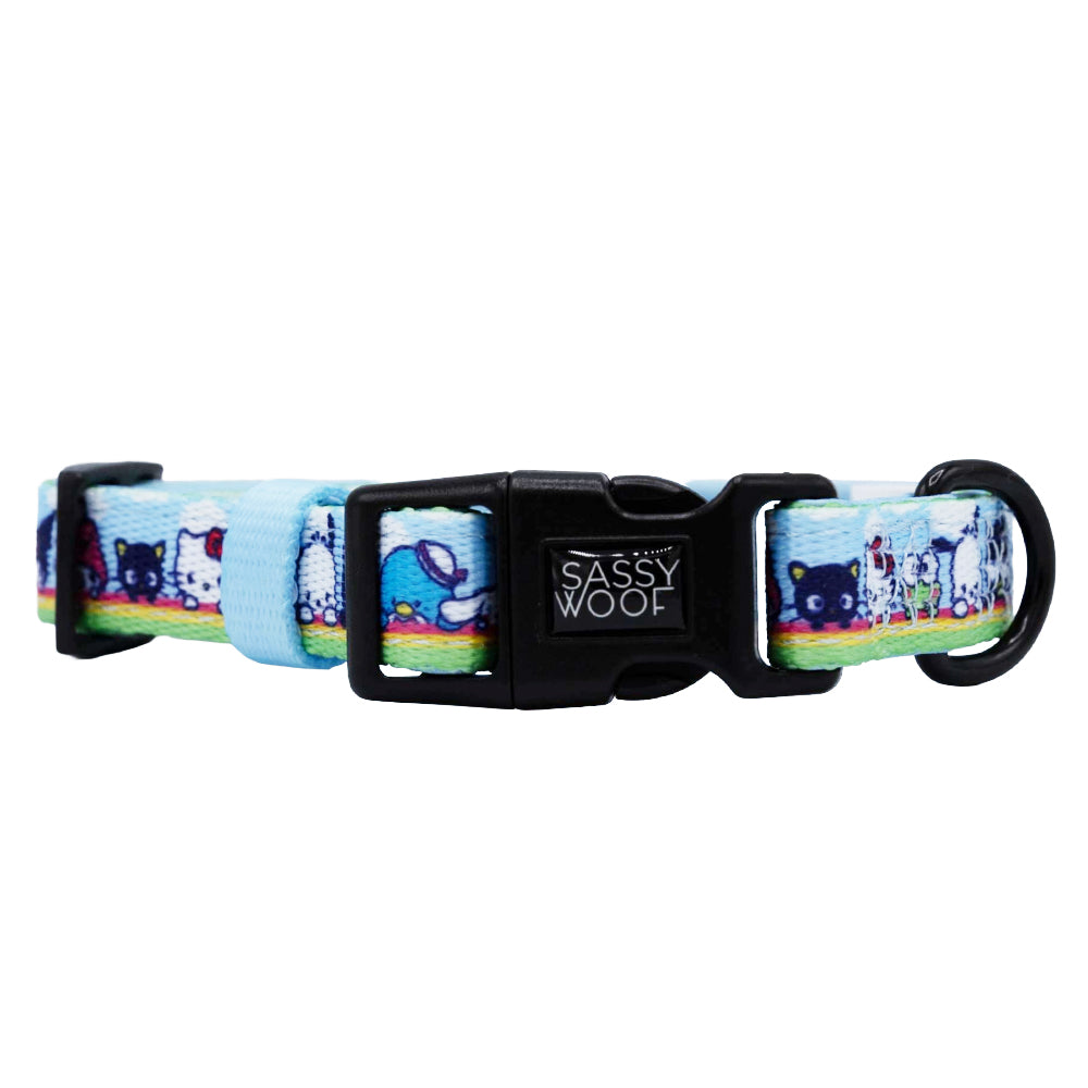 The Sassy Woof Dog Four Piece Bundle - Hello Kitty® & Friends In the Sky features playful cartoon designs on a light blue background with a black buckle—an adorable Sanrio pet accessory for any collection.