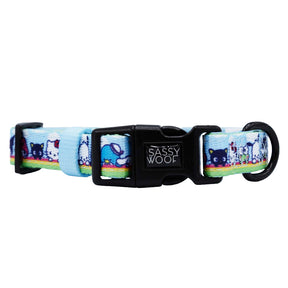 The Sassy Woof Dog Four Piece Bundle - Hello Kitty® & Friends In the Sky features playful cartoon designs on a light blue background with a black buckle—an adorable Sanrio pet accessory for any collection.