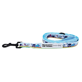 The Sassy Woof Dog Leash - Hello Kitty® & Friends In the Sky is a blue leash with Hello Kitty and friends, neatly rolled with a black metal clip and a white label reading "HELLO KITTY AND FRIENDS | SASSY WOOF.