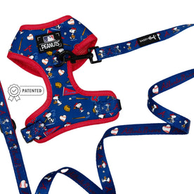 The Sassy Woof Dog Two Piece Bundle - MLB™ x Peanuts™ Atlanta Braves™ includes a blue and red Snoopy harness and leash set with team logos, baseball dog accessories, equipment, a PATENTED badge, and co-branded graphics.