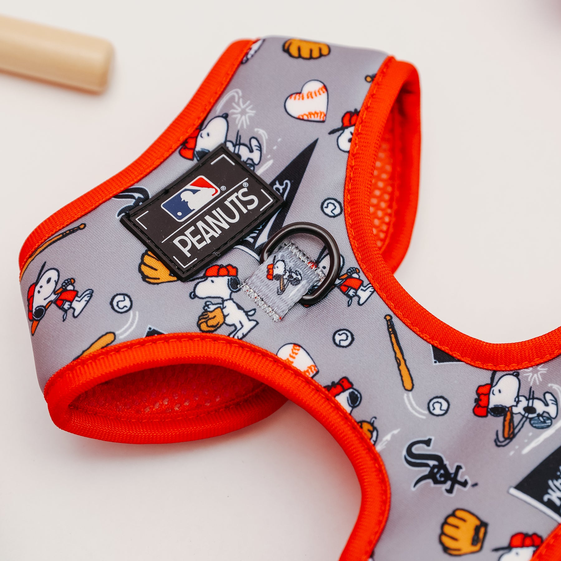 The Sassy Woof Harness Three Piece Bundle - MLB™ x Peanuts™ Chicago White Sox™ features Snoopy in baseball gear, balls, bats, gloves, and team logos with orange trim—perfect for your puppy’s growth.