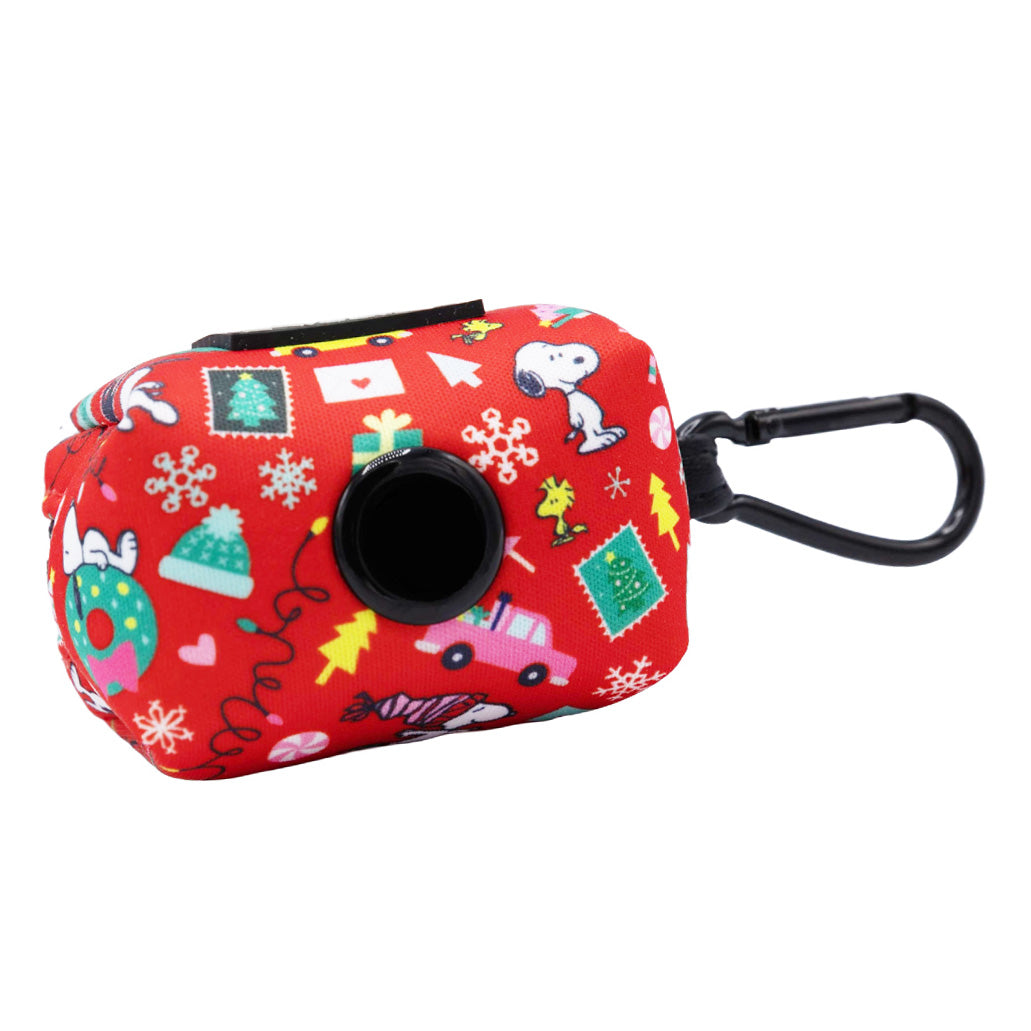 Celebrate the holidays with the Dog Waste Bag Holder - Peanuts™ Beagle Bells from Sassy Woof. Featuring festive Peanuts cartoon designs, a red holder with a black dispenser opening, and a convenient black clip for attaching to your leash or bag, this playful accessory is perfect for Snoopy fans looking to brighten up their collection.