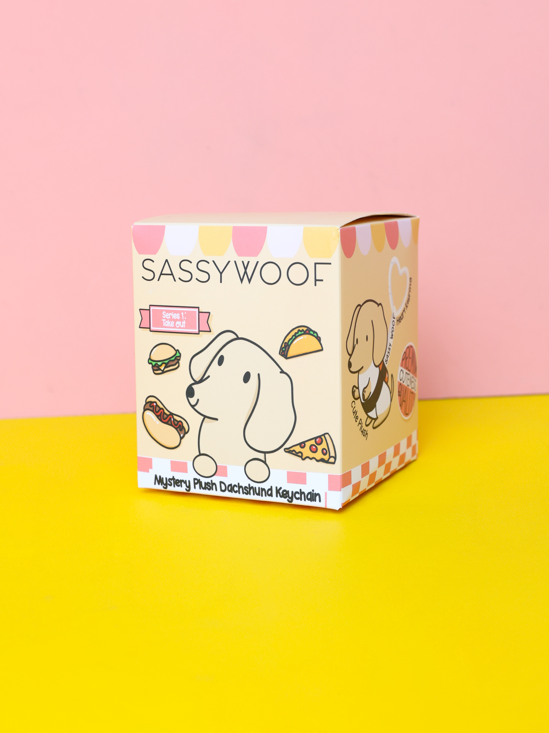 A pastel-colored Sassy Woof Blind Box features a cartoon dachshund, food images, and the text “Mystery Plush Dachshund Keychain” on a pink and yellow background.